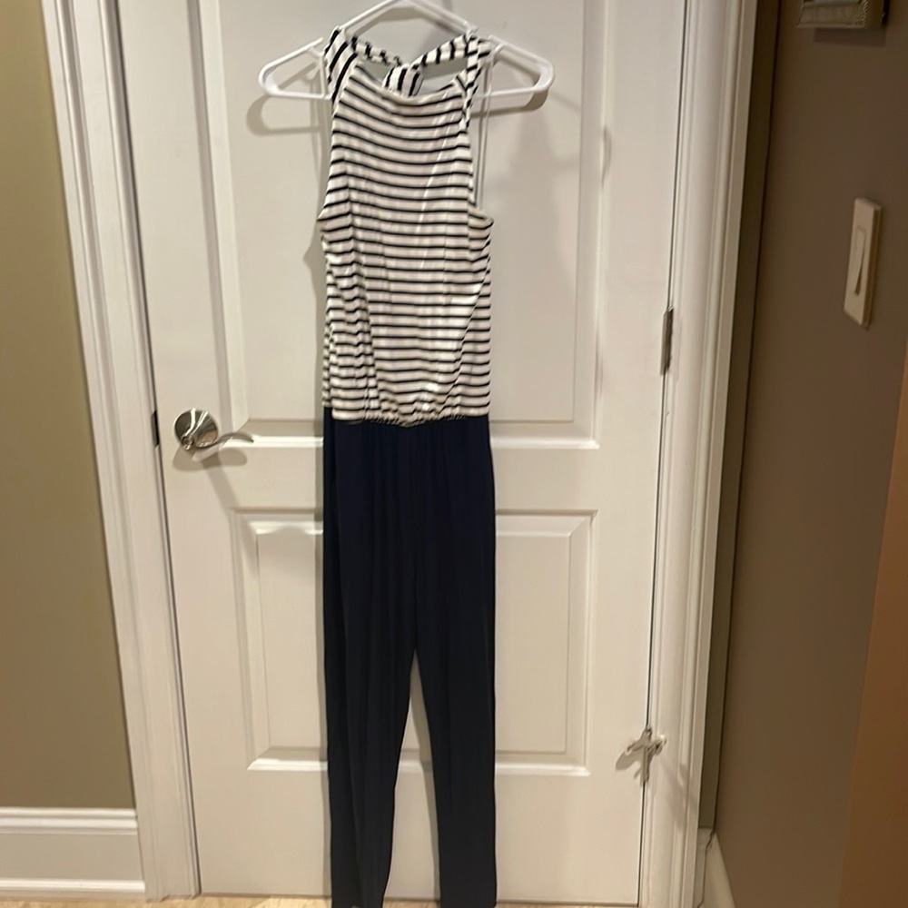 Navy and white backless halter styled jumpsuit.